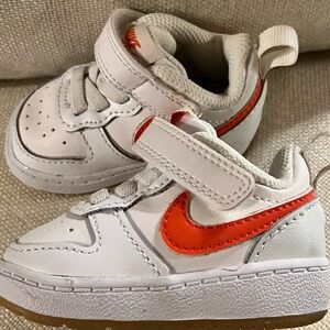 Nike Kids White Sneakers with Orange Swoosh